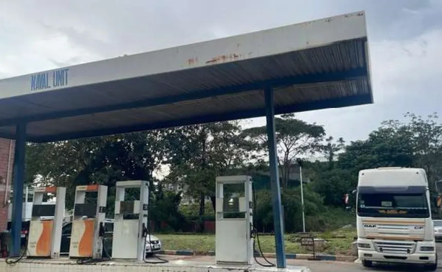 Naval Unit fuel station with pumps and a tanker truck