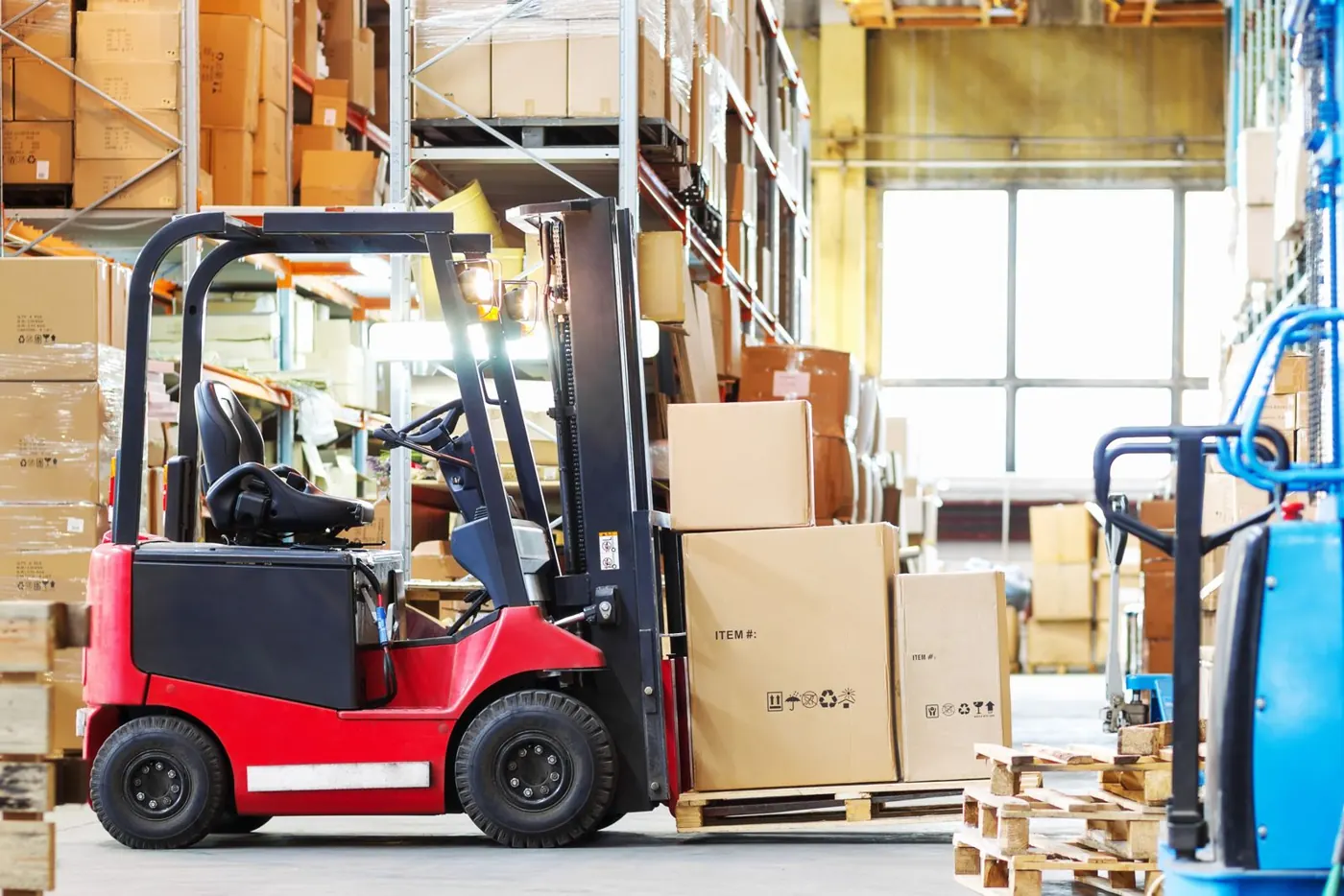 Forklift in a stocked warehouse